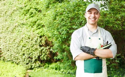 Team member wearing PPE during gardening work